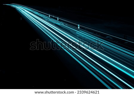 blue car lights at night. long exposure Royalty-Free Stock Photo #2339624621