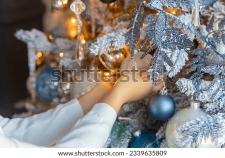 Christmas photo child decorates a Christmas tree. Selective focus. holiday.