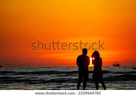 A couple is watching the sunrise, they look very happy and peaceful.
Photo taken on the beach of Dien Thanh commune, Dien Chau district, Nghe An province, Vietnam.