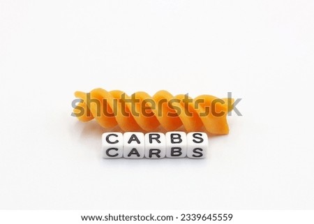 An orange helically cooked paste called Fusilli on white background