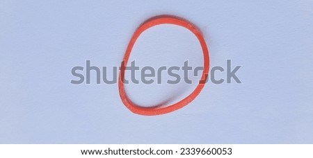 a single red elastic rubber isolated in white background
