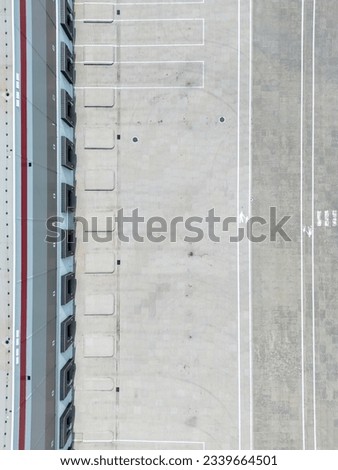 aerial drone view of  warehouse building with empty docks in distribution center 
