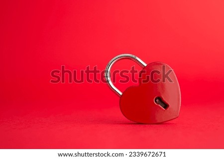 Love red heart shape padlock on red background with copy space. Find love, romantic, dating in online internet website, app dating community platform and Valentine day love symbol concept. Royalty-Free Stock Photo #2339672671