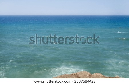 Gorgeous turquoise water seen from the coast of Ericeira, Portugal