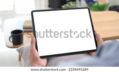 Hand using digital tablet with blank screen for mock up, template, people technology and lifestyle 