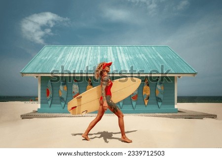 Surfer girl running with board on the sandy beach against surf station. Surfer female.Beautiful young woman at the beach. water sports. Healthy Active Lifestyle. Surfing. Summer Vacation.  Royalty-Free Stock Photo #2339712503