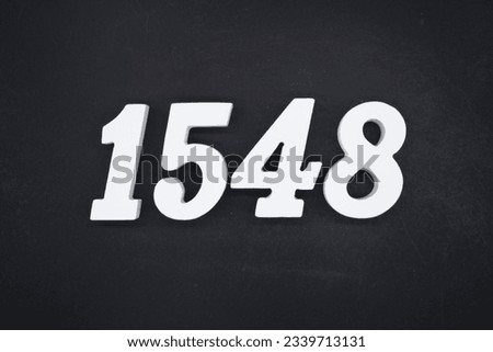 Black for the background. The number 1548 is made of white painted wood.