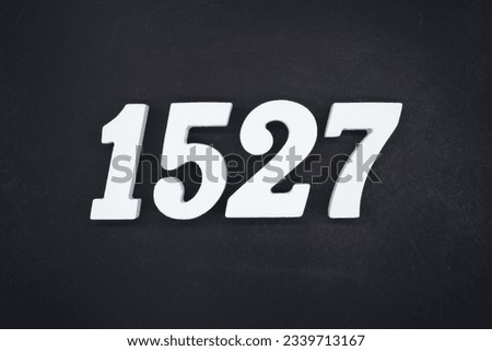 Black for the background. The number 1527 is made of white painted wood.
