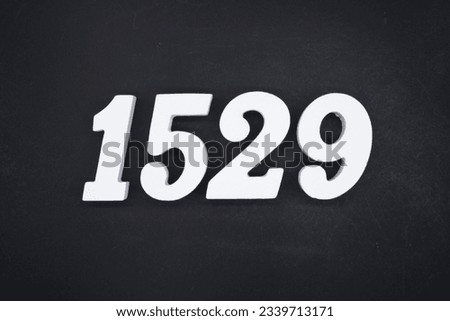 Black for the background. The number 1529 is made of white painted wood.
