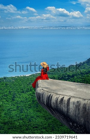 Tourist standing on The rock near Da nang viewpoint, Da nang in Vietnam. Royalty-Free Stock Photo #2339719641