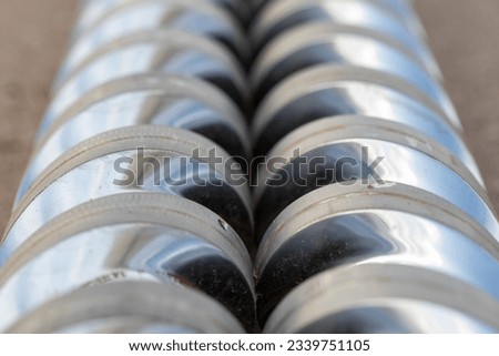 Angle view Close-up injection machine screw spare parts injection machine manufacturing process concept. Royalty-Free Stock Photo #2339751105