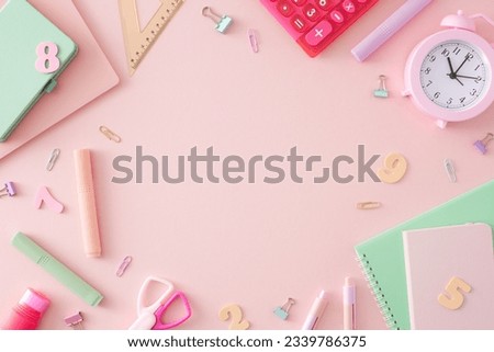 Ready for productivity concept. Top view arrangement of alarm clock, calculator, assorted school supplies, colorful numbers on pastel pink background with empty space for promo or text Royalty-Free Stock Photo #2339786375