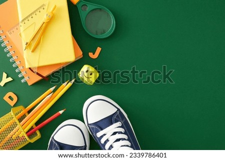 Preparing for the school season. Top view photo of assorted school stationery, colorful letters on green background with empty space for promo or text