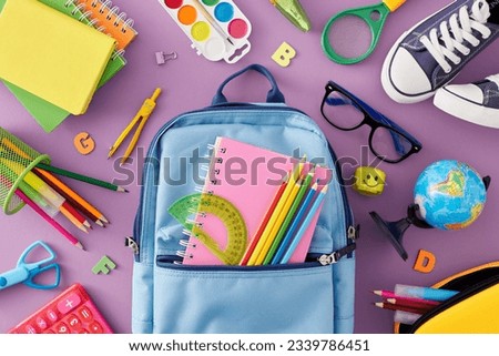 Immersed in the wonders of education for young kids. Top view photo of school stationery, calculator, globe, kids shoes, stylish bag, eyewear, letters on pastel purple background