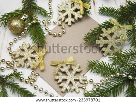 Christmas Card with Christmas Decoration on a wooden background