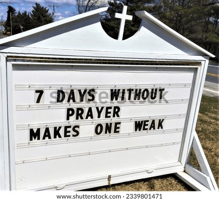 A sign at a church reads " 7 DAYS WITHOUT PRAYER MAKES ONE WEAK.    