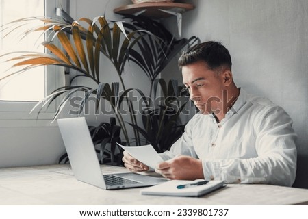 Confused frustrated young man reading letter, debt notification, bad financial report, money problem, money problem, upset student receiving bad news, unsuccessful exam or test results Royalty-Free Stock Photo #2339801737