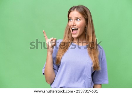 Young beautiful woman over isolated background intending to realizes the solution while lifting a finger up