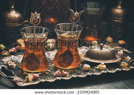 Turkish  tea  served on copper tray, selective focus with shallow depth of field