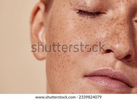 Cropped shot of the face of a young woman with freckles Royalty-Free Stock Photo #2339824079