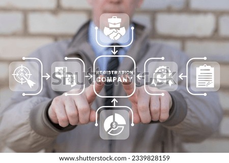 Man using virtual touch screen presses inscription: REGISTRATION COMPANY. New company registration concept. Business start up. Brand and identity building process. Company formation procedure. Royalty-Free Stock Photo #2339828159