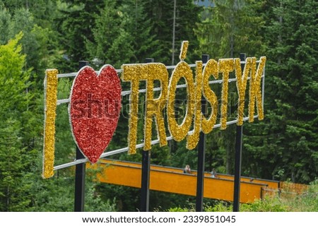 A sign at the junction of the border of Poland, Slovakia and the Czech Republic with the text "I love Tripoint"