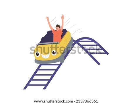 Happy excited teenager boy riding rollercoaster racing along rails having fun in amusement park Royalty-Free Stock Photo #2339866361