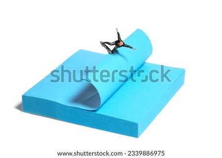 Creative miniature people toy figure photography. Sticky notes installation. A men skater playing skateboarding sport at skate park. Isolated on white background. Image photo