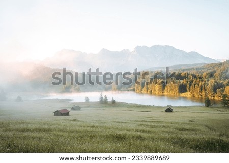 Amazing foggy Sunrise at Geroldsee, also Wagenbruchsee, Bavaria, Germany Europe Royalty-Free Stock Photo #2339889689