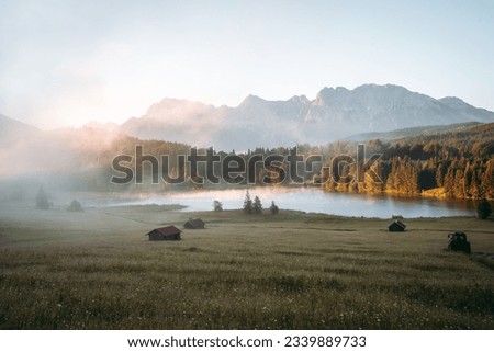 Amazing foggy Sunrise at Geroldsee, also Wagenbruchsee, Bavaria, Germany Europe Royalty-Free Stock Photo #2339889733