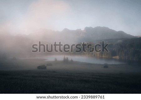Amazing foggy Sunrise at Geroldsee, also Wagenbruchsee, Bavaria, Germany Europe Royalty-Free Stock Photo #2339889761