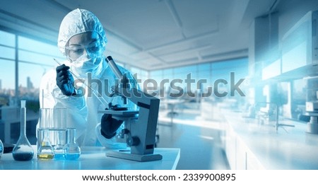 Woman virologist. Laboratory assistant sitting at table. Virologist in chemical protection suit. Scientist near test tubes and microscope. Research on dangerous bacteria. Virologist studies microbes Royalty-Free Stock Photo #2339900895