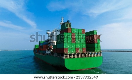 wide angle shot rear view of cargo container ship sailing in sea blue sky background to import export goods and distributing products to dealer and consumers worldwide, by container ship Transport
