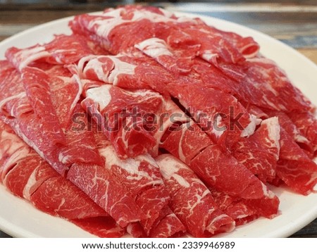 This picture is a thinly sliced beef.