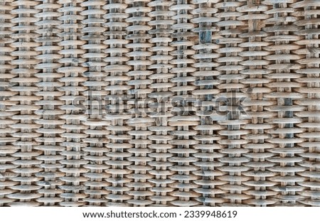 a photography of a woven wall with a wooden frame, a close up of a woven wall with a wooden frame.