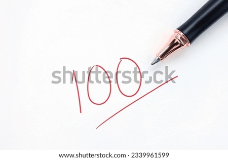 Educational concept, pen with written in red ink on white paper. full score test,red 100 full mark isolated on a white paper. Royalty-Free Stock Photo #2339961599