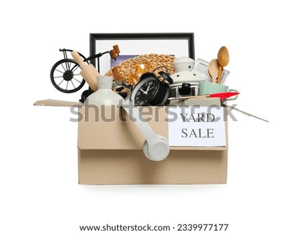 Sign Yard Sale written on box with different stuff isolated on white