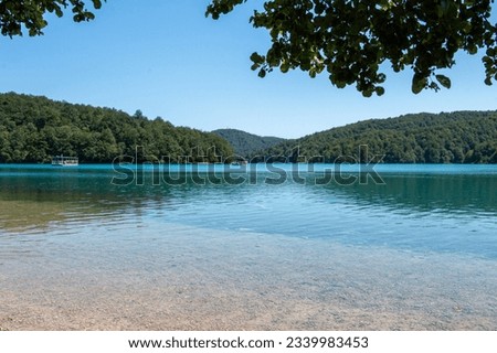 View across the stunningly clear blue waters of Lake Kozjak in Plitvice Lakes National Park in Croatia Royalty-Free Stock Photo #2339983453