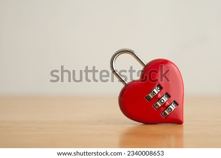 Love red heart shape code lock on wooden white wall background. Find love, romantic, dating in online internet website, app dating community platform and Valentine day love symbol concept.