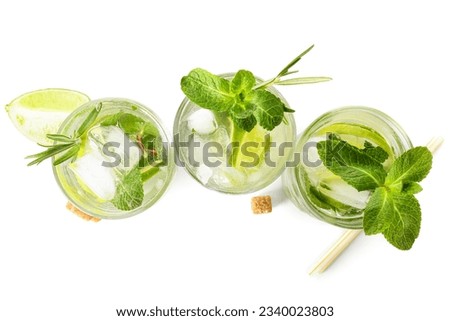 Glasses of tasty mojito isolated on white background