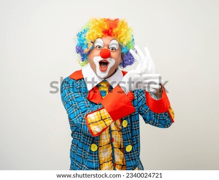 Mr Clown. Portrait of Funny face Clown man in colorful uniform standing variety action. Happy expression male bozo in various pose on isolated background. Royalty-Free Stock Photo #2340024721