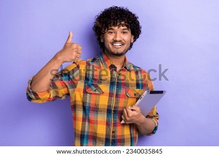 Portrait of young satisfied man thumb up recommendation good job secretary approved your resume isolated over purple color background