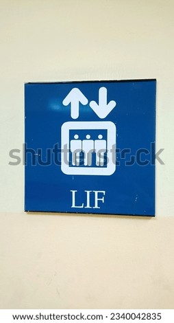A picture of elevator sign. 