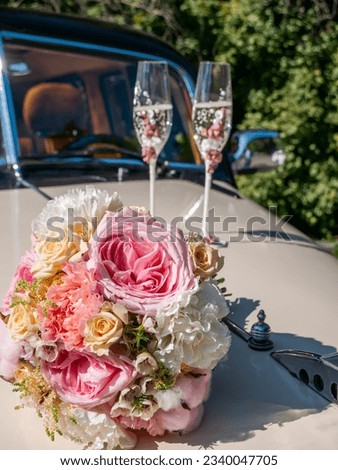 Bride and groom, wedding dress, bridal bouquet and champagne, wedding rings and accessories, a wedding cake