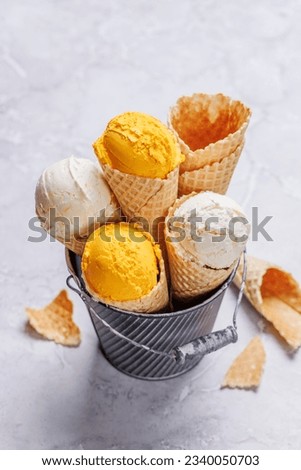 Lemon ice cream in delightful waffle cones, a treat for every taste bud. Over stone background