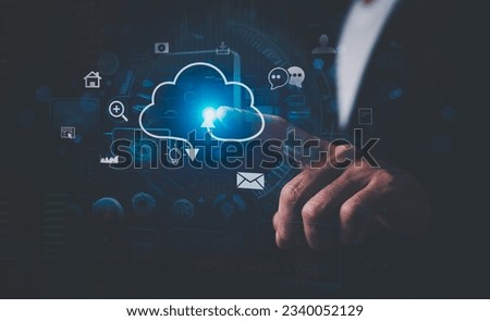 Information technologist or businessman pointing cloud computing icon. Cloud computing concept. Royalty-Free Stock Photo #2340052129