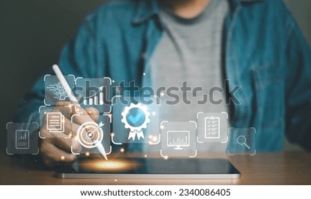 Entrepreneur using electronic devices for store customer data to gain customer insight in order to create marketing campaign that can help to increase sale and identify potential customer. Royalty-Free Stock Photo #2340086405