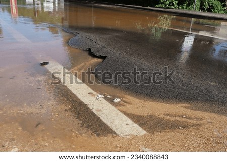 Flooded street, traffic problems, excess water Royalty-Free Stock Photo #2340088843
