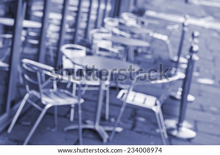 Blurred out bar chairs and tables