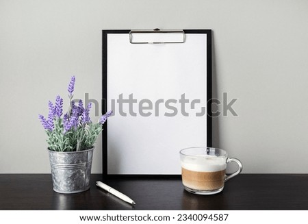 Blank stationery: clipboard, pen, cappuccino and artificial lavender. Template for graphic designers portfolios.